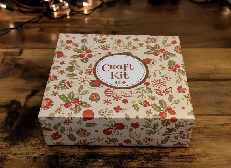 A berry-patterned Craft Kit box on a wooden table